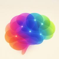 Abstract illustration of a human brain composed of overlapping translucent shapes in vibrant rainbow colors with glowing points.