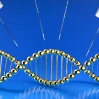 A gold DNA double helix structure is surrounded by three syringes with needles on a blue background.