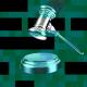 A digital rendering of a judge's gavel striking a sound block against a background of green and black pixelated squares, symbolizing the concept of social media censorship.