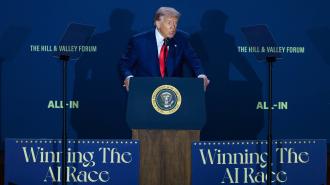A man in a suit stands at a podium with the presidential seal, speaking at an event with signs that read "Winning The AI Race" and "ALL-IN.