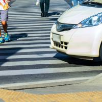 A man riding a bike on a city street.