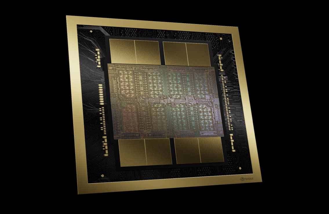 A gold-framed computer chip against a black background.