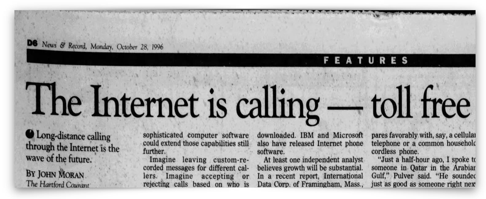 A newspaper article headline reads, "The Internet is calling — toll free," discussing free long-distance calling via the Internet, dated October 28, 1996.